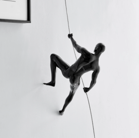 Glossy Black Wall Sculpture Climbing 15" Man